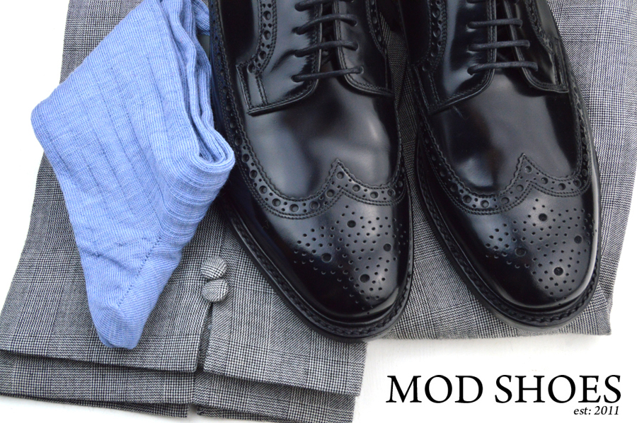 mod shoes loake black royals with prince of wales check trousers and light blue socks